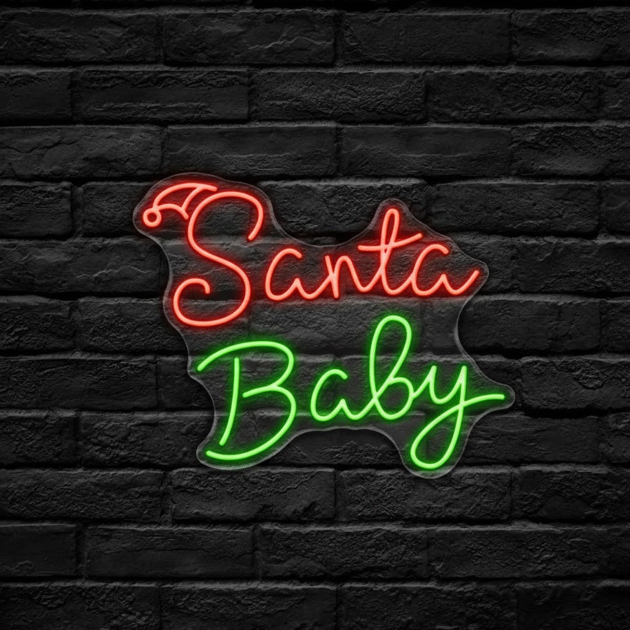 Neon sign with 'Santa Baby' on a black brick wall