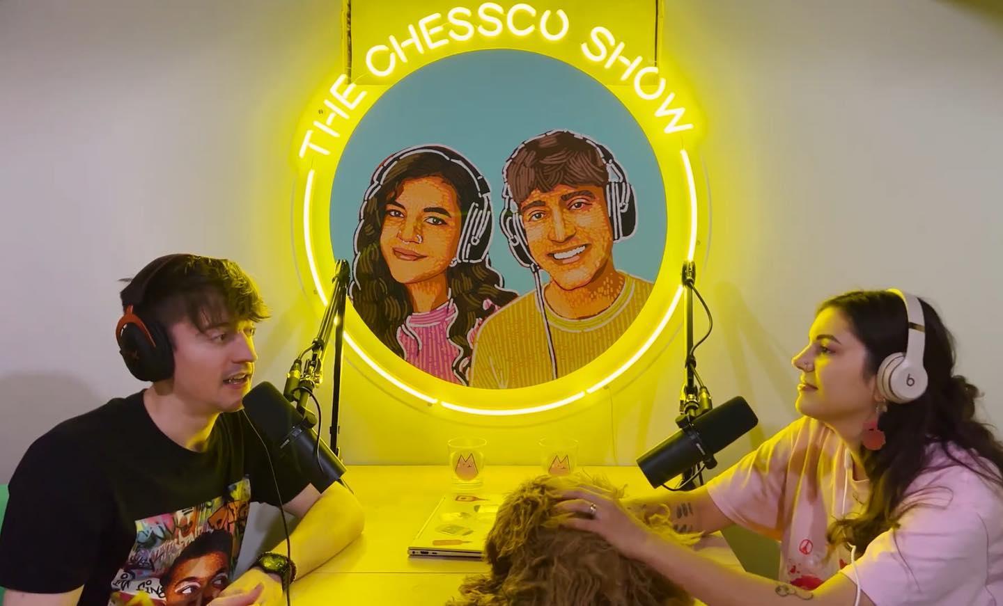 yellow neon sign featuring two youtubers