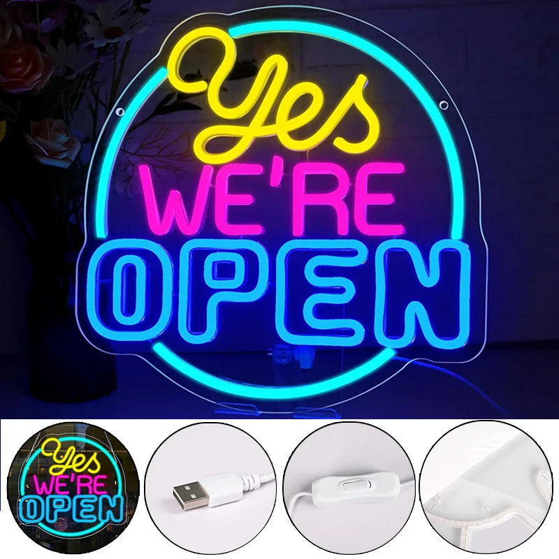 Neon sign with 'Yes We're Open' text on a brick wall background