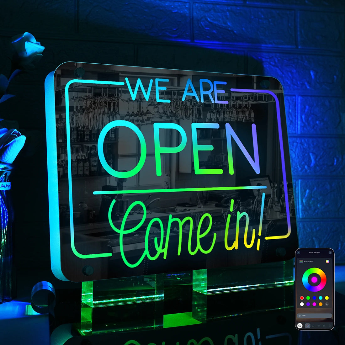 Neon sign with 'We are open, come in!' text on a dark background