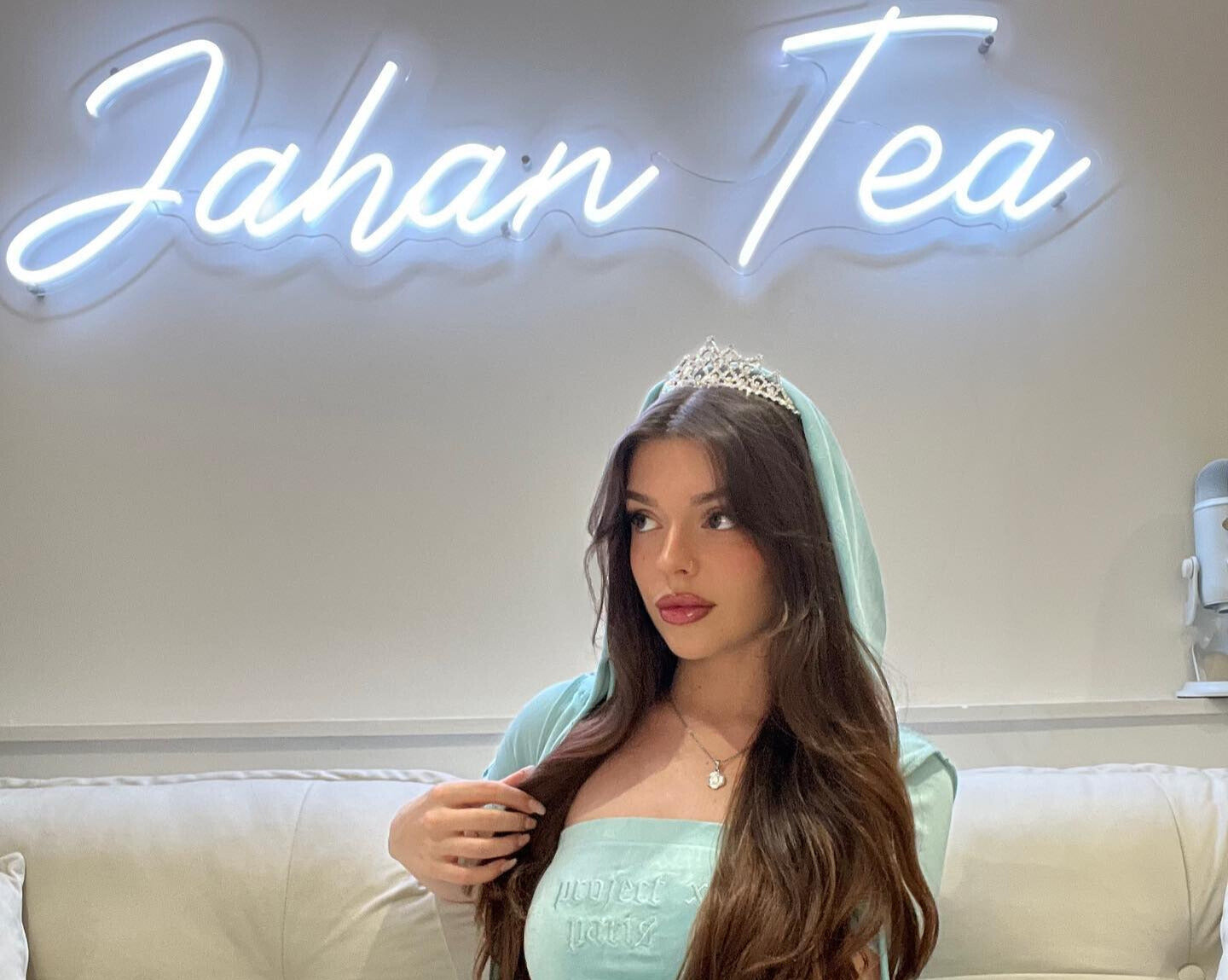 white neon sign that says &quot;Jahan tea&quot;
